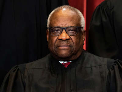 Associate Justice Clarence Thomas sits during a group photo of the Justices at the Supreme Court in Washington, D.C. on April 23, 2021.