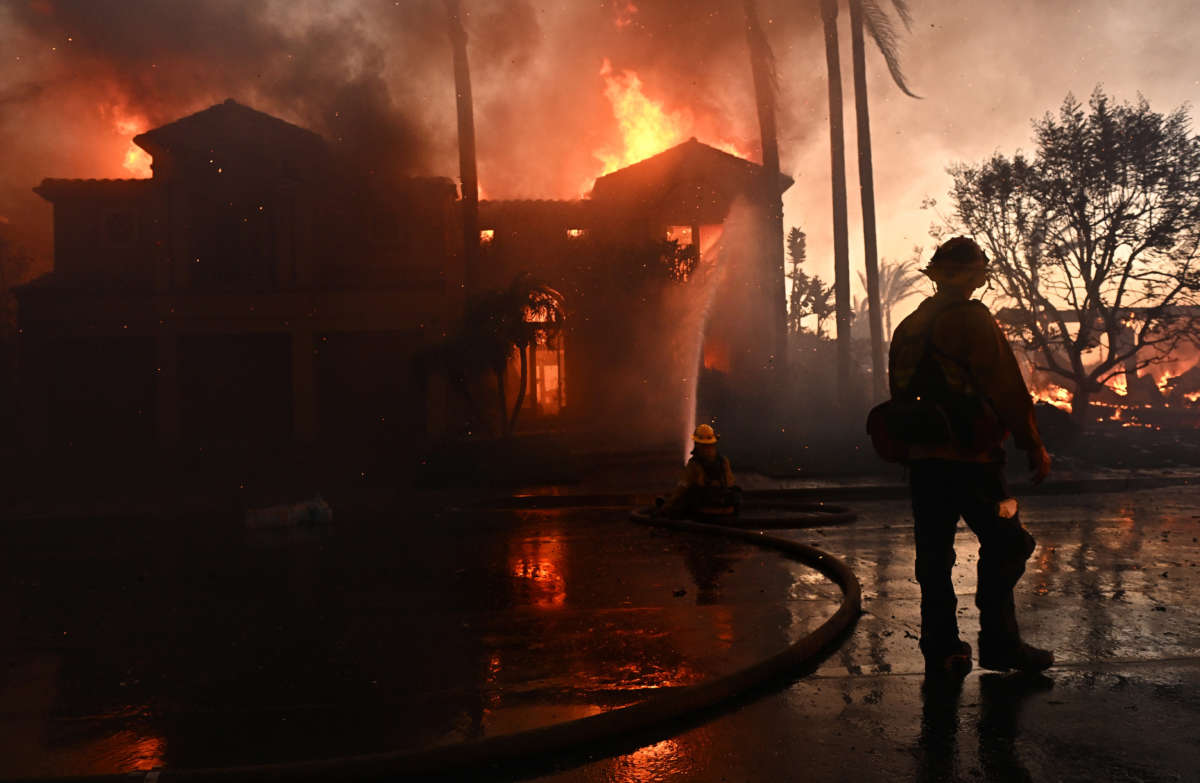 Firefighters battle the Coastal fire at Coronado Pointe in Laguna Niguel on May 11, 2022.