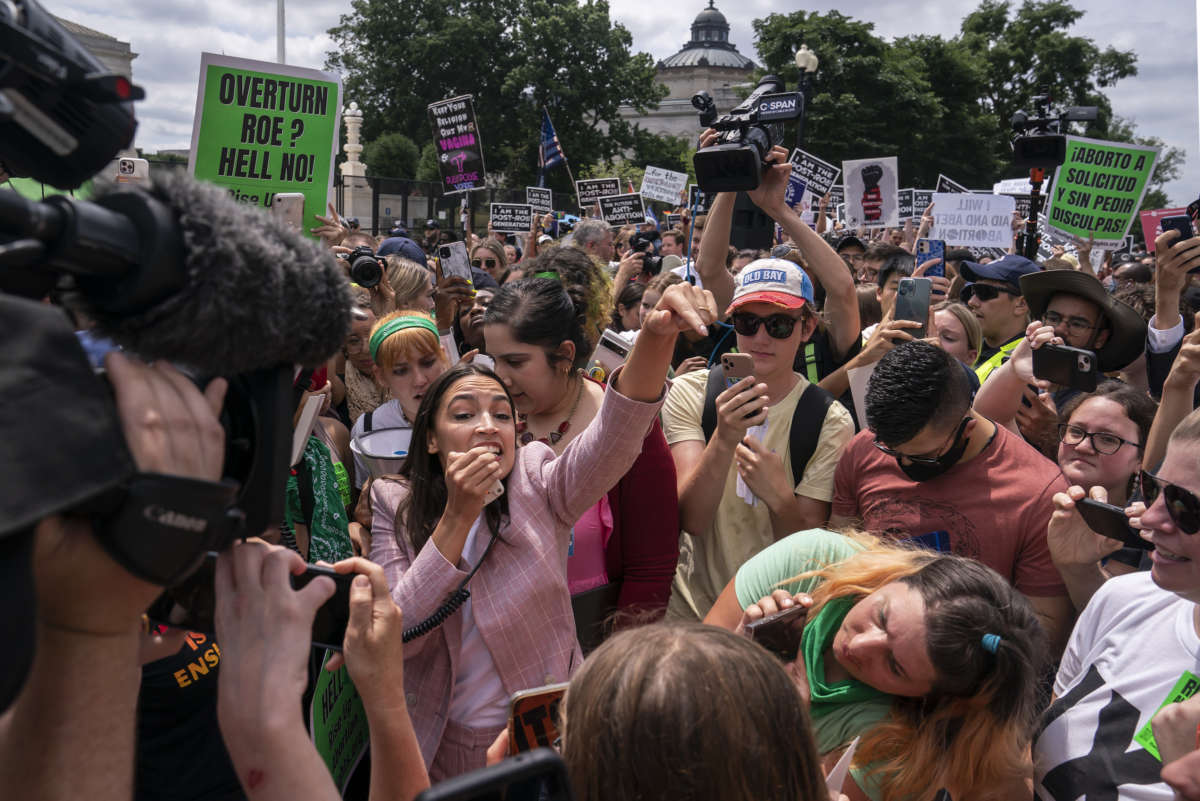 Rep. Alexandria Ocasio-Cortez (D-New York) speaks to abortion-rights activists in front of the U.S. Supreme Court after the Court announced a ruling in the Dobbs v. Jackson Women's Health Organization case on June 24, 2022 in Washington, D.C.