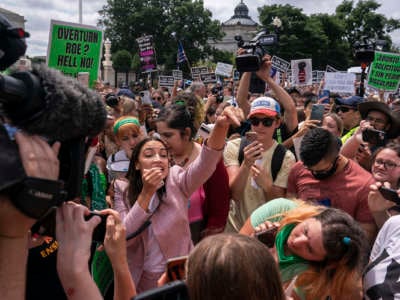 Rep. Alexandria Ocasio-Cortez (D-New York) speaks to abortion-rights activists in front of the U.S. Supreme Court after the Court announced a ruling in the Dobbs v. Jackson Women's Health Organization case on June 24, 2022 in Washington, D.C.