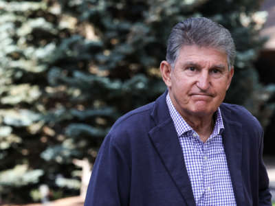 Sen. Joe Manchin walks to a morning session during the Allen & Company Sun Valley Conference on July 7, 2022 in Sun Valley, Idaho.
