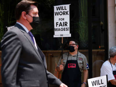 Activists with One Fair Wage participate in a wage strike demonstration outside of the Old Ebbitt Grill restaurant on May 26, 2021, in Washington, D.C.