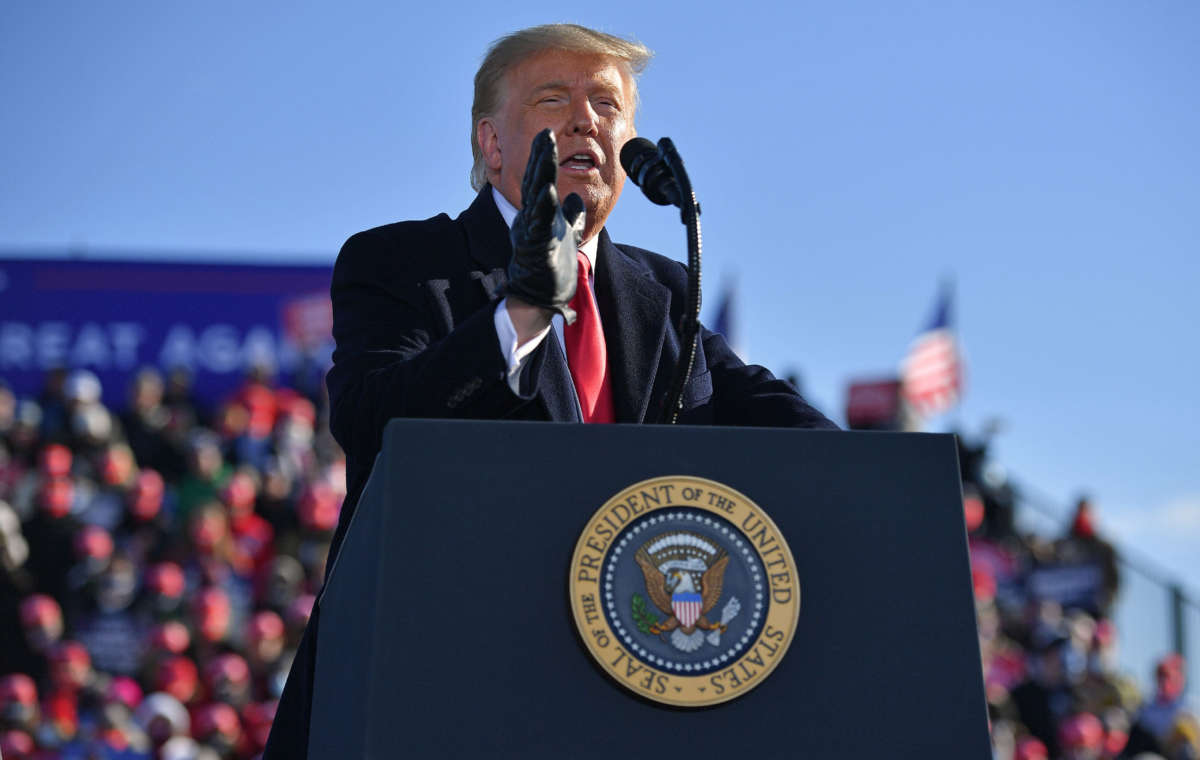 Then-President Donald Trump speaks during a campaign rally at Green Bay Austin Straubel International Airport in Green Bay, Wisconsin, on October 30, 2020.