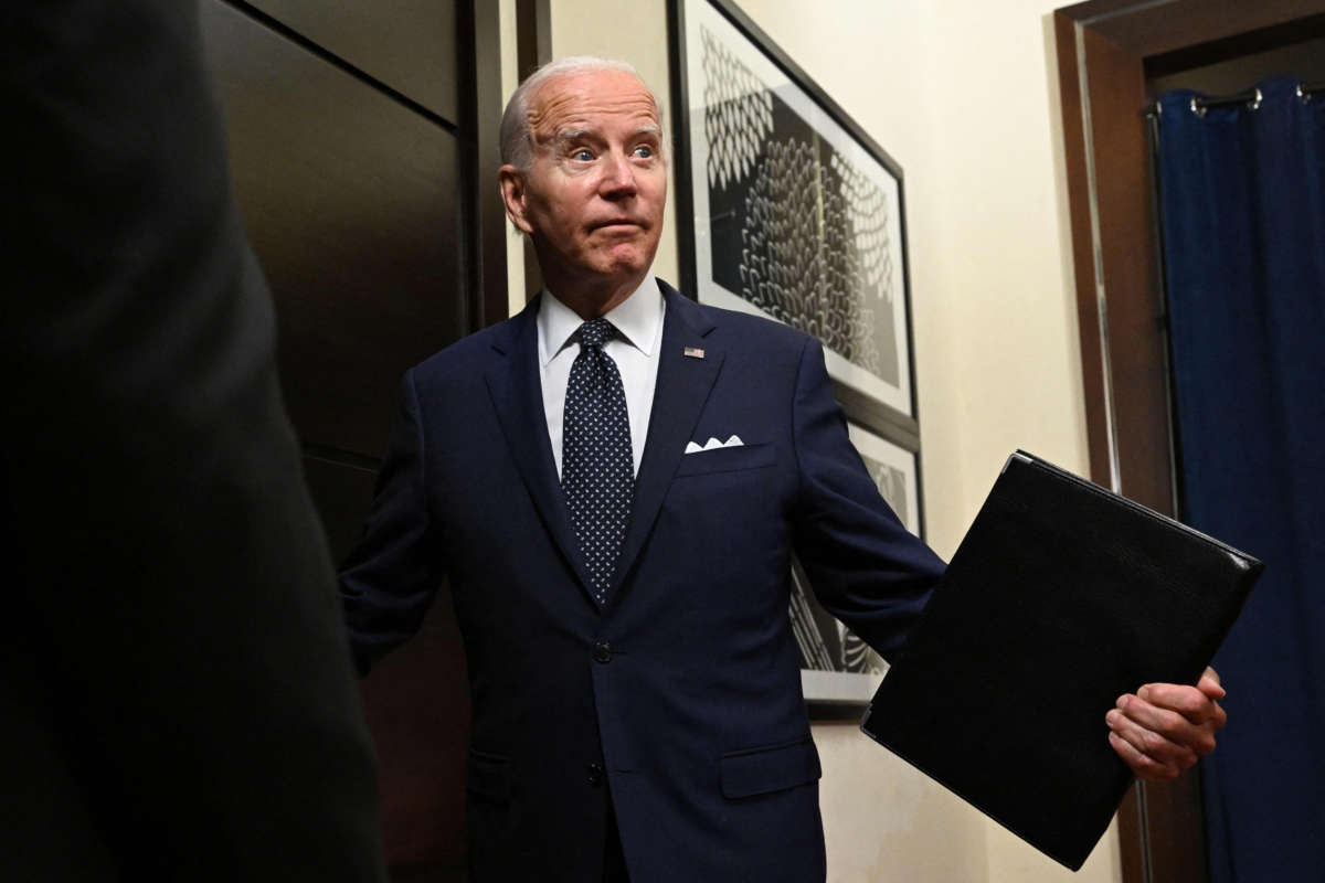 President Joe Biden exits the room at the Al-Salam Palace in Jeddah, on July 15, 2022.