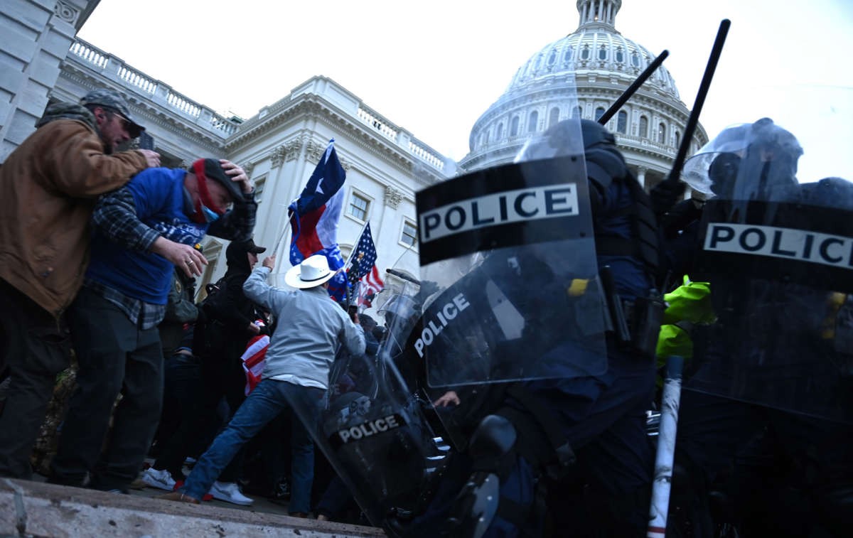 Trump supporters clash with police and security forces as they storm the U.S. Capitol in Washington, D.C., on January 6, 2021.