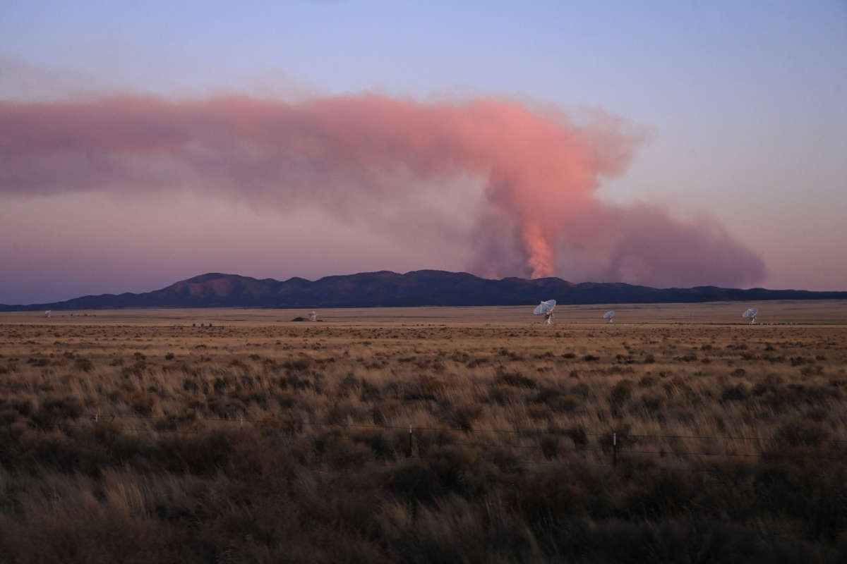 The Very Large Array is seen in front of the Bear Trap Fire as it burns in the San Mateo Mountains on May 12, 2022, in Socorro County, New Mexico.