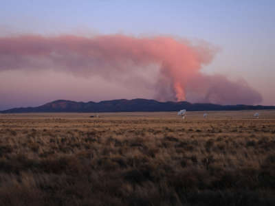 The Very Large Array is seen in front of the Bear Trap Fire as it burns in the San Mateo Mountains on May 12, 2022, in Socorro County, New Mexico.