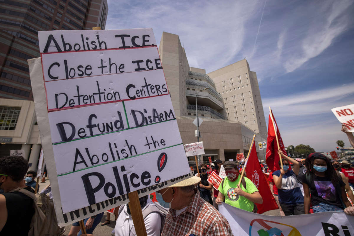 People protest U.S. Immigration and Customs Enforcement jails outside the Metropolitan Detention Center in Los Angeles, California, on May 1, 2021.