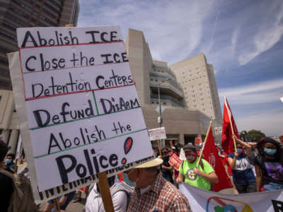 People protest U.S. Immigration and Customs Enforcement jails outside the Metropolitan Detention Center in Los Angeles, California, on May 1, 2021.