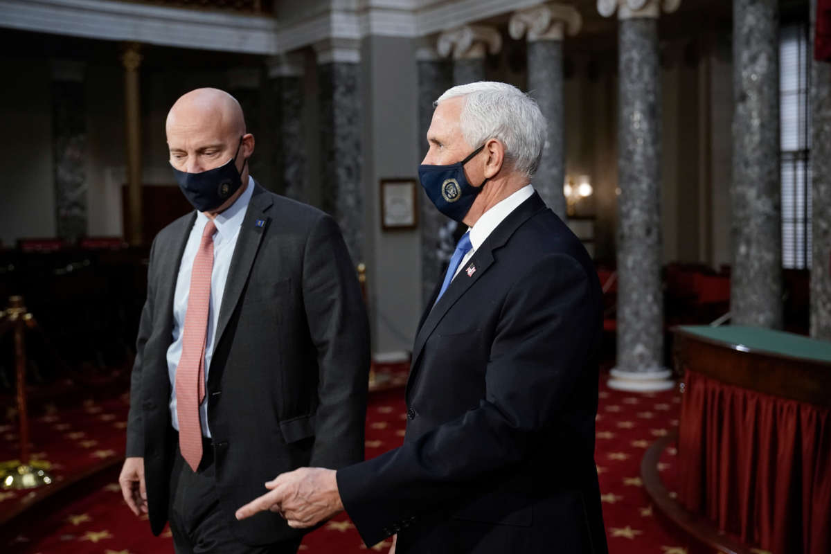 Vice President Mike Pence, joined by Chief of Staff Marc Short, left, finishes a swearing-in ceremony for senators in the Old Senate Chamber on Capitol Hill on January 3, 2021, in Washington, D.C.