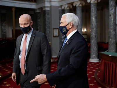 Vice President Mike Pence, joined by Chief of Staff Marc Short, left, finishes a swearing-in ceremony for senators in the Old Senate Chamber on Capitol Hill on January 3, 2021, in Washington, D.C.