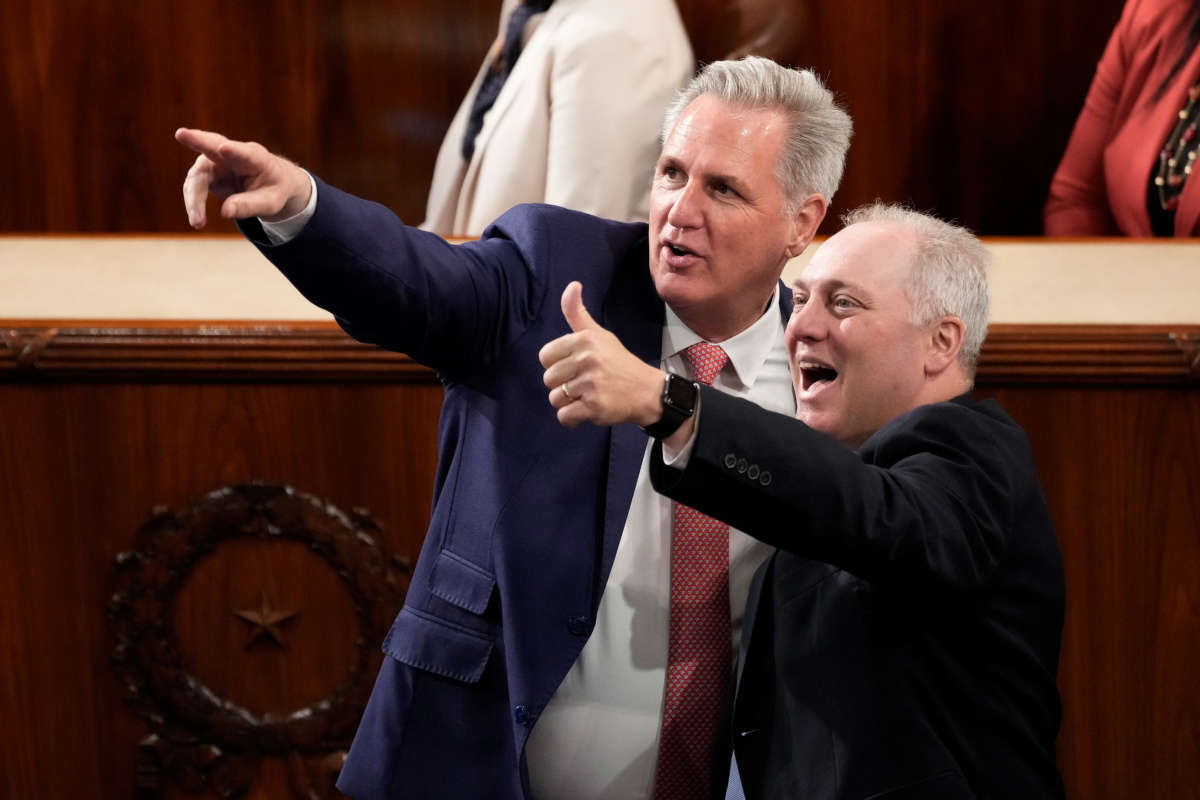 House Minority Leader Kevin McCarthy, left, and House Minority Whip Steve Scalise point out friends in the House Chamber of the U.S. Capitol on May 17, 2022, in Washington, D.C.