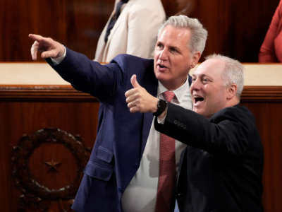 House Minority Leader Kevin McCarthy, left, and House Minority Whip Steve Scalise point out friends in the House Chamber of the U.S. Capitol on May 17, 2022, in Washington, D.C.