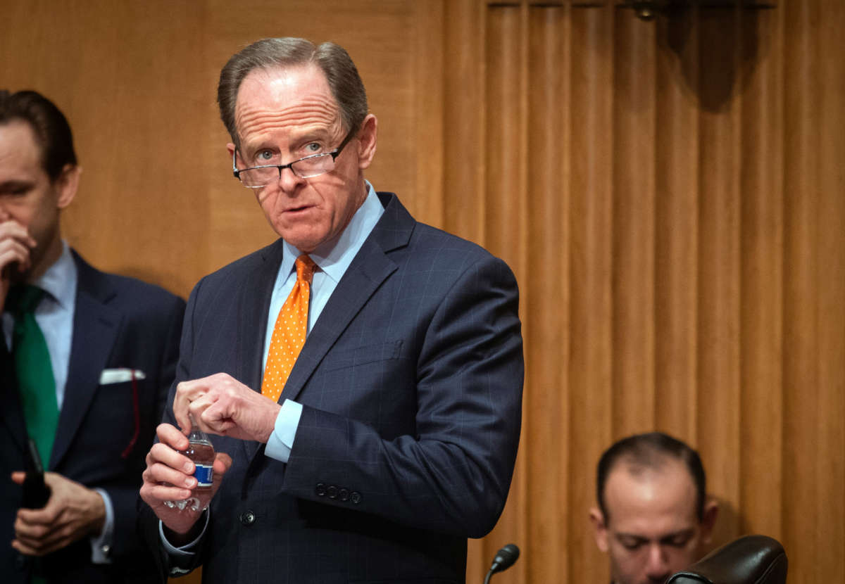 Sen. Pat Toomey waits for the start of the Senate Banking Committee hearing on February 15, 2022, in Washington, D.C.