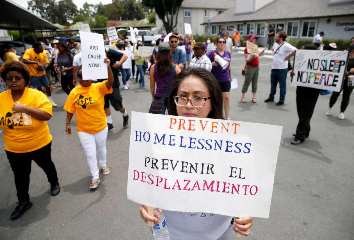 Tenants and activists march after a rally at the Delta Pines apartment complex in Antioch, California, on June 22, 2022.