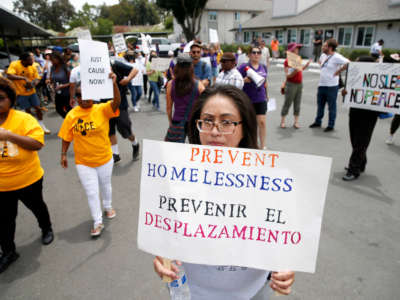 Tenants and activists march after a rally at the Delta Pines apartment complex in Antioch, California, on June 22, 2022.