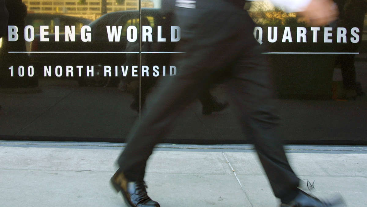 A man walks past the Boeing World Headquarters in Chicago