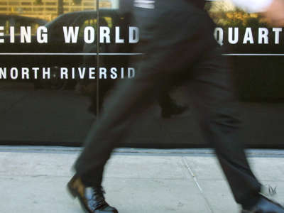 A man walks past the Boeing World Headquarters in Chicago