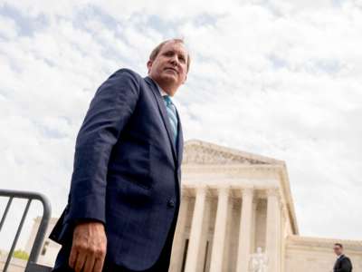 Texas Attorney General Ken Paxton speaks to reporters in front of the Supreme Court in Washington, D.C., on April 26, 2022.