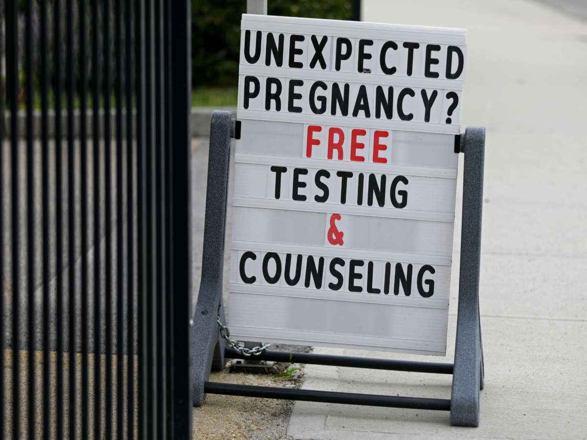 A sign stands outside Problem Pregnancy, a so-called "crisis pregnancy center," on Pleasant Street in Worcester, Massachusetts. It is located near a Planned Parenthood center.