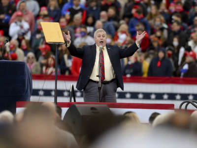 Berks County Commissioner Christian Leinbach sings the National Anthem at the Reading Regional Airport in Bern Township, Pennsylvania, on October 31, 2020 where Donald J. Trump spoke during a campaign rally for his bid for reelection.