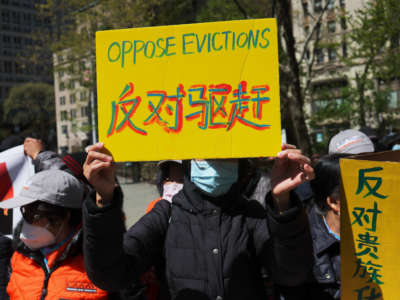 People gather for a rally protesting rent hikes at City Hall Park on April 28, 2022, in New York City.