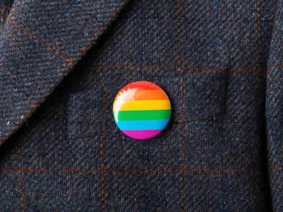 LGBTQ Pride flag pin on coat
