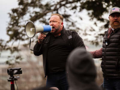 Alex Jones, the founder of right-wing media group Infowars, addresses a crowd of pro-Trump protesters after they stormed the grounds of the Capitol Building on January 6, 2021, in Washington, D.C.