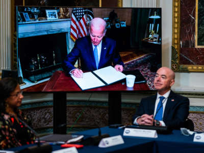 President Joe Biden signs an executive order virtually during the first meeting of the interagency Task Force on Reproductive Healthcare Access in the Indian Treaty Room at the Eisenhower Executive Office Building on August 3, 2022.