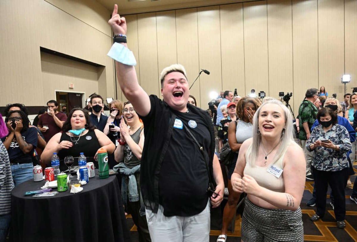 Jae Moyer of Overland Park and Allie Utley of Allen County, Kansas, cheer as Kansans for Constitutional Freedom and supporters celebrate their win during an election watch party on August 2, 2022, at the Overland Park Convention Center.