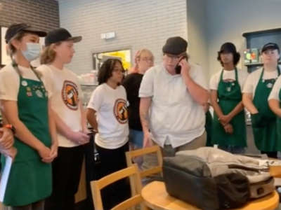 Unionized Starbucks workers in South Carolina present their manager with a list of demands before the manager walks out.