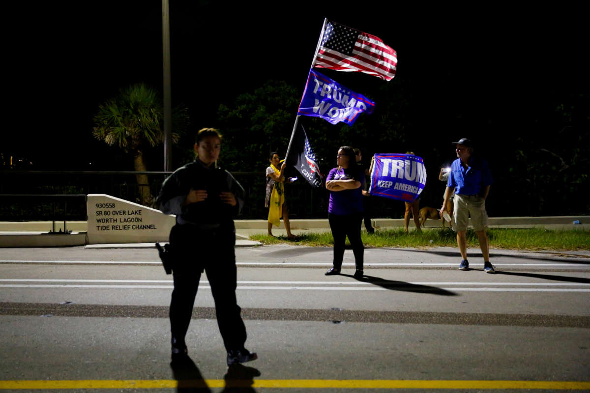 Supporters of former President Donald Trump rally near his home at Mar-A-Lago on August 8, 2022, in Palm Beach, Florida.