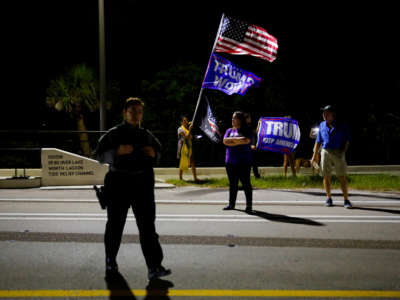 Supporters of former President Donald Trump rally near his home at Mar-A-Lago on August 8, 2022, in Palm Beach, Florida.