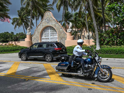 Local law enforcement officers are seen in front of the home of former President Donald Trump at Mar-A-Lago in Palm Beach, Florida, on August 9, 2022.