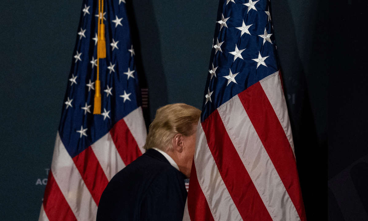 Former President Donald Trump departs after speaking at the America First Policy Institute's America First Agenda summit at the Marriott Marquis on July 26, 2022, in Washington, D.C.