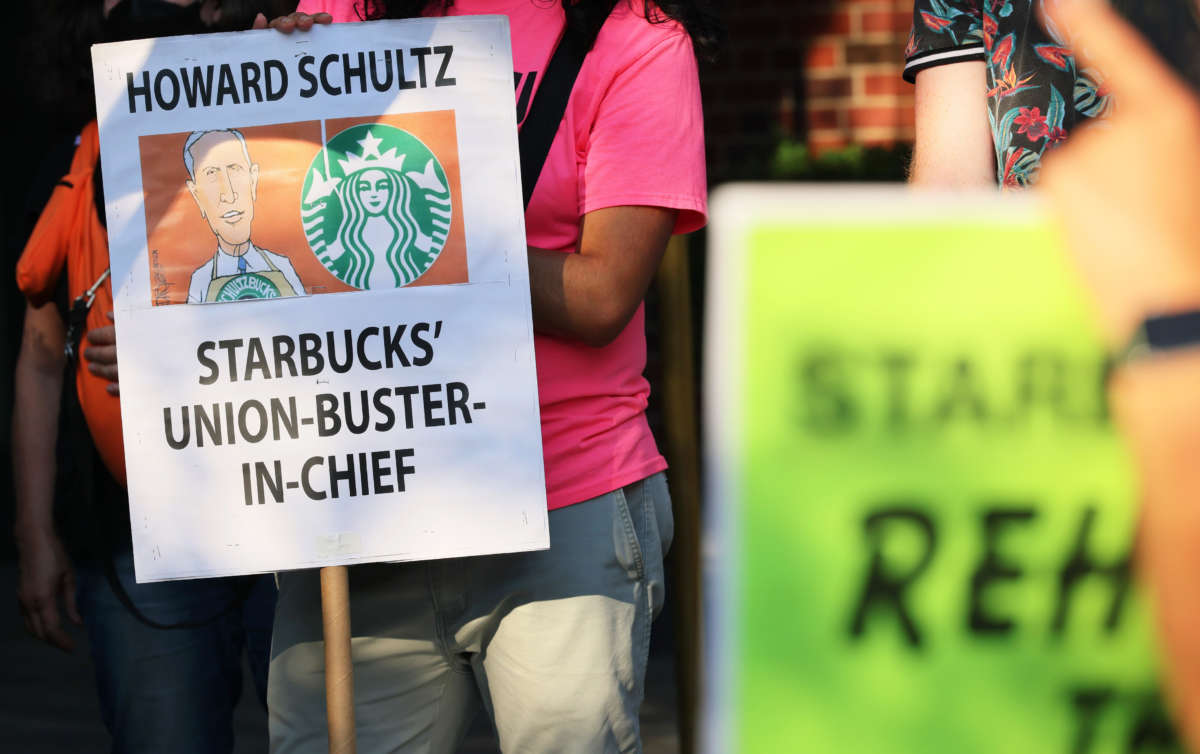 Activists participate in an event dubbed the Un-Birthday Party and picket line for Starbucks CEO Howard Schultz on July 19, 2022, in New York City.