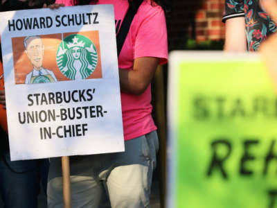 Activists participate in an event dubbed the Un-Birthday Party and picket line for Starbucks CEO Howard Schultz on July 19, 2022, in New York City.