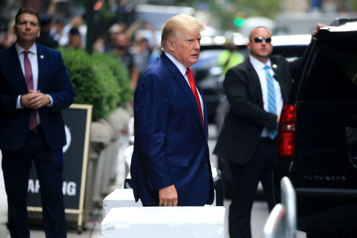 Donald Trump walks toward a car