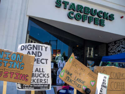 Signs are displayed outside of Starbucks Coffee in Brookline, Massachusetts, on August 12, 2022.