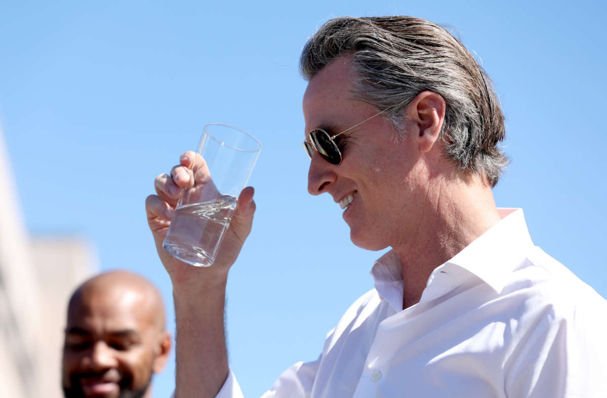 California Gov. Gavin Newsom tastes wastewater that was treated at the Antioch Water Treatment Plant on August 11, 2022, in Antioch, California.