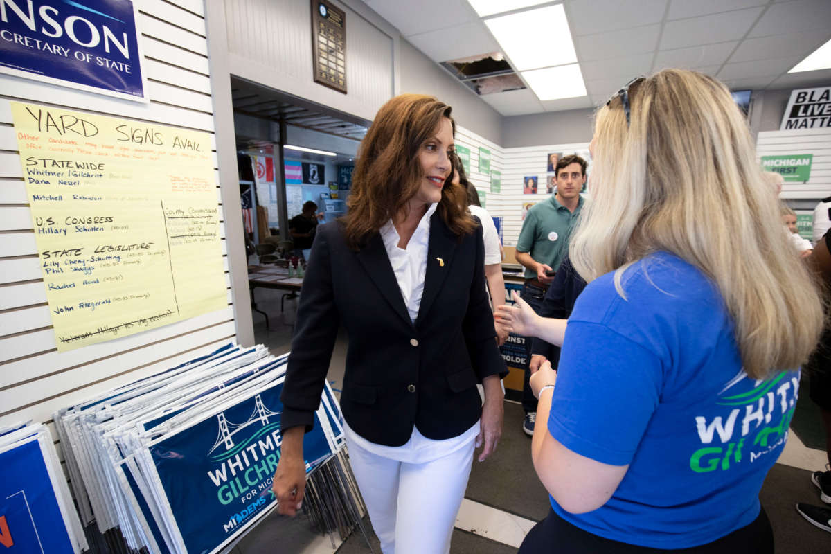 Michigan Governor Gretchen Whitmer, left, speaks with a volunteer at a canvass kickoffs event on Michigan Primary Election Day on August 2, 2022, in Grand Rapids, Michigan.