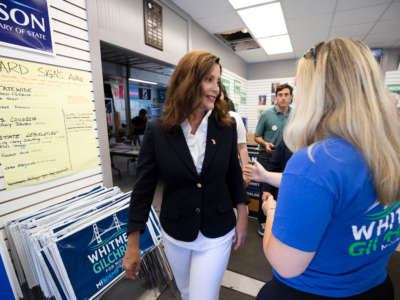 Michigan Governor Gretchen Whitmer, left, speaks with a volunteer at a canvass kickoffs event on Michigan Primary Election Day on August 2, 2022, in Grand Rapids, Michigan.