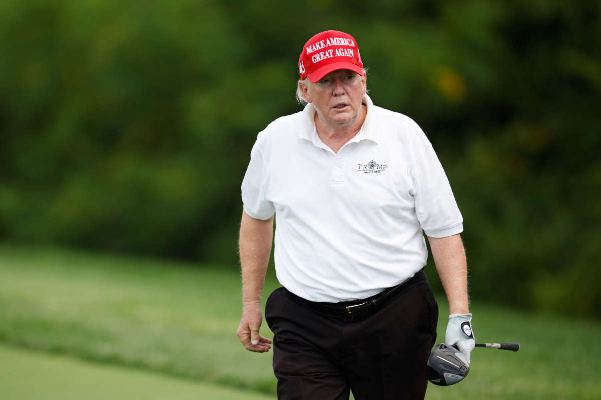 Former President Donald Trump reacts after his shot from the second tee during the pro-am prior to the LIV Golf Invitational - Bedminster at Trump National Golf Club Bedminster on July 28, 2022, in Bedminster, New Jersey.