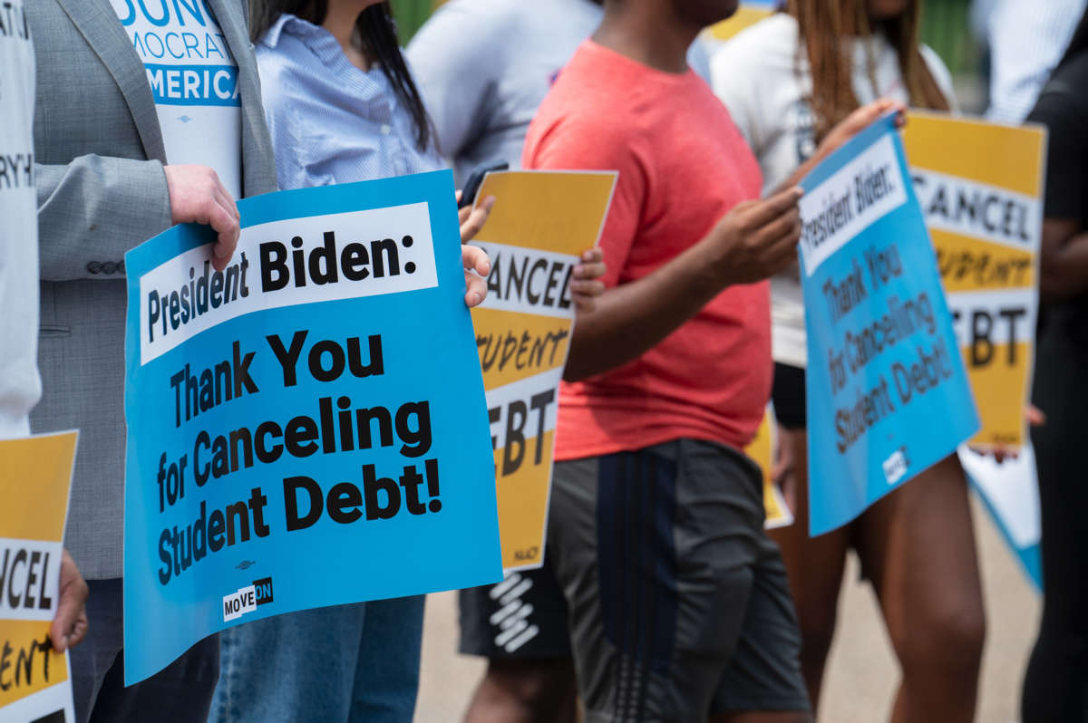 Student loan debt activists rally outside the White House a day after President Biden announced a plan that would cancel $10,000 in student loan debt for those making less than $125,000 a year in Washington, D.C., on August 25, 2022.