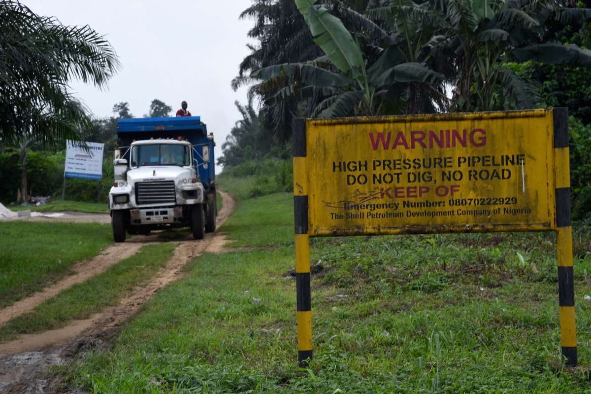 A truck drives along a high pressure oil pipeline in Southern Nigeria