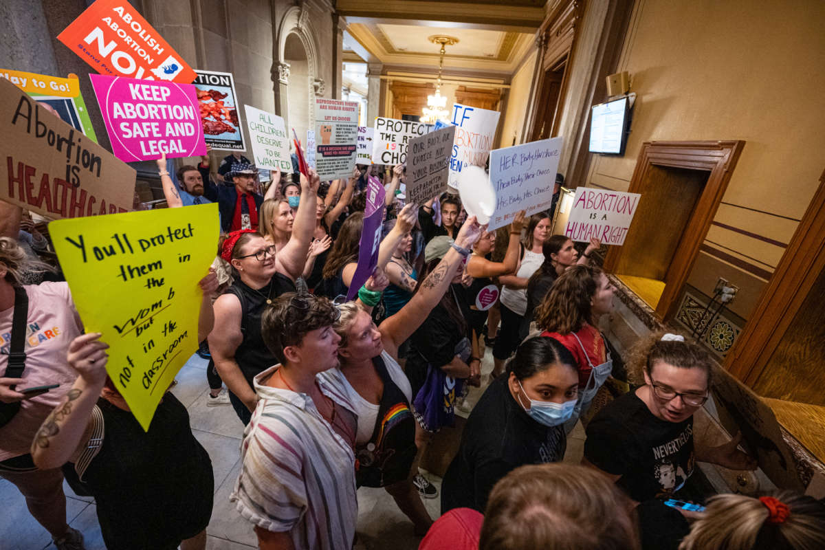 Abortion rights protesters chant during a session of the Indiana State Senate on July 25, 2022, in Indianapolis, Indiana.