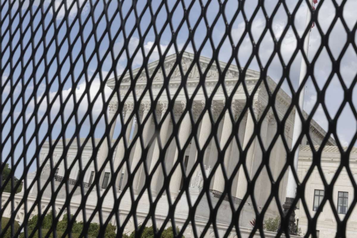 The front of the U.S. Supreme Court, seen through a fence line on Capitol Hill in Washington, D.C., on July 14, 2022.