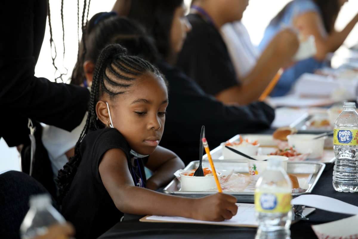 An incoming fourth-grade student at Compton Avenue Elementary School samples and tastes new breakfast and lunch menu items at Ramón C. Cortines School of Visual and Performing Arts on July 29, 2022, in Los Angeles, California.