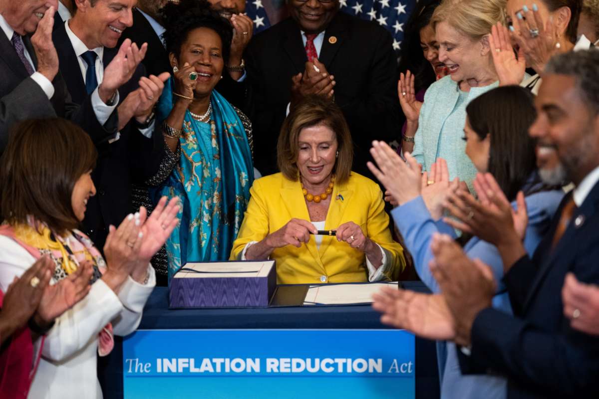 Speaker of the House Nancy Pelosi signs the Inflation Reduction Act during the bill enrollment ceremony in the Washington, D.C. on August 12, 2022.