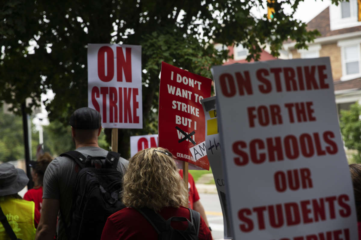Columbus City School teachers strike outside of Livingston Elementary School in Columbus, Ohio, on August 22, 2022.